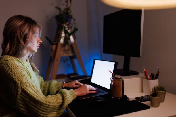 istock Young woman working late from home 1363037525