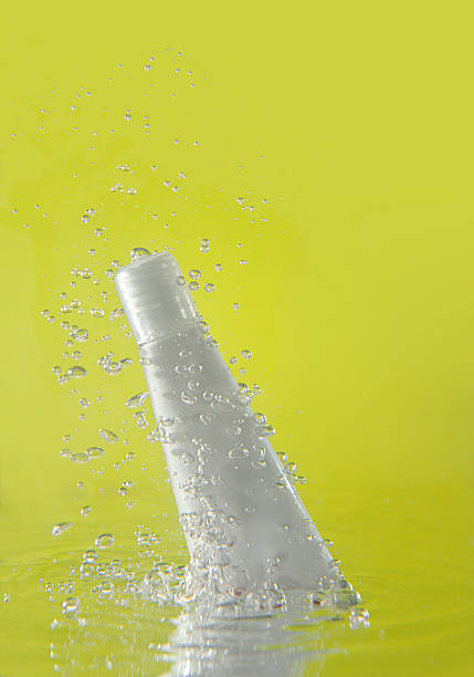 istock splash of cosmetic bottle falling in water 136303865
