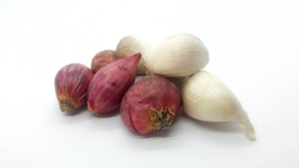 istock Onion and garlic isolated on white background 1363038695