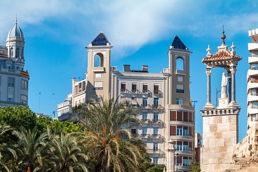 Statue of San Pascual Bailon (1940) by José Ortells López on Puente del Mar (Sea Bridge) in Valencia, Spain, with private apartments in the  background.