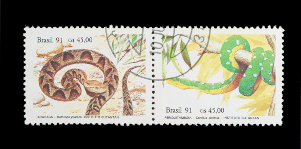 brazilian postage stamp, on black background. studio shot. 1991.