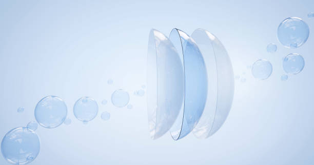 Contact lenses in water surface with air bubbles on blue background. Eye lens cleaning solution concept, medical equipment for optical vision correction, mockup for package design. Realistic 3d render Contact lenses in water surface with air bubbles on blue background. Eye lens cleaning solution concept, medical equipment for optical vision correction, mockup for package design, Realistic 3d render contact lens stock pictures, royalty-free photos & images