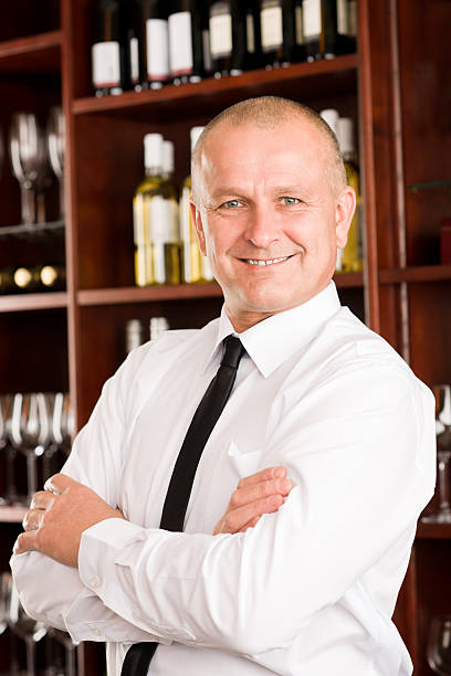 istock Wine bar waiter happy male in restaurant 136304498