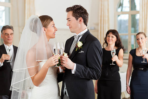 istock Bridal couple clinking glasses 136304509