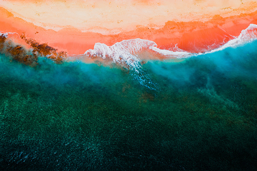 A wild colour palette featuring vibrant turquoise blues and blazing reds. This aerial image depicts the harsh beauty of nature. Photographed in remote Western Australia.