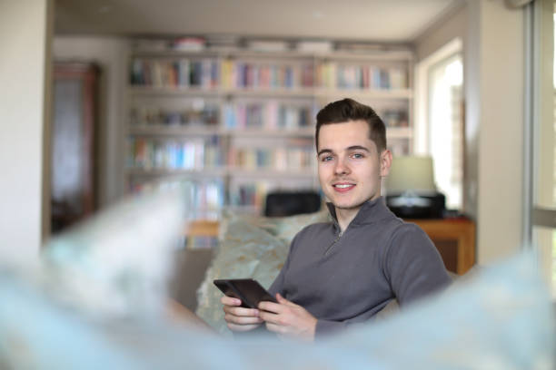 istock A Young man relaxing on the sofa at home. 1363047162
