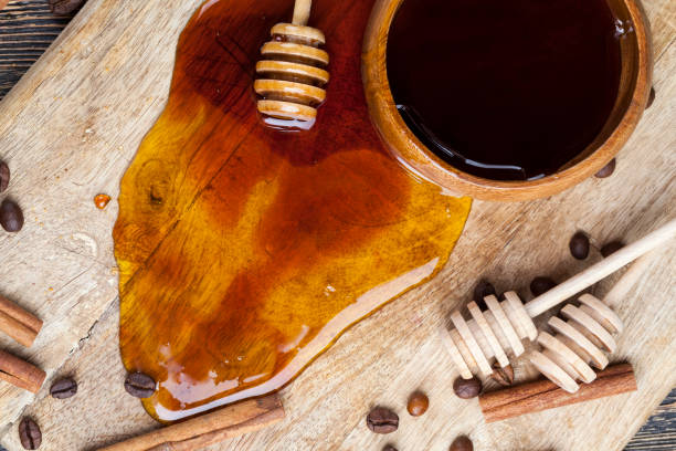istock fresh bee honey poured on a board 1363051922
