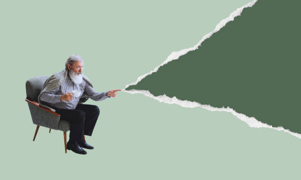 Senior man wearing retro style clothes sitting in armchair isolated on torn paper background. Contemporary art collage. Minimalism
