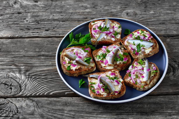 istock pickled sprat rye bread open sandwiches, top view 1363055545