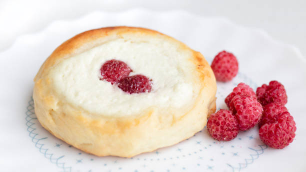 istock Sweet pastries with cottage cheese and fresh raspberry on plate 1363055598