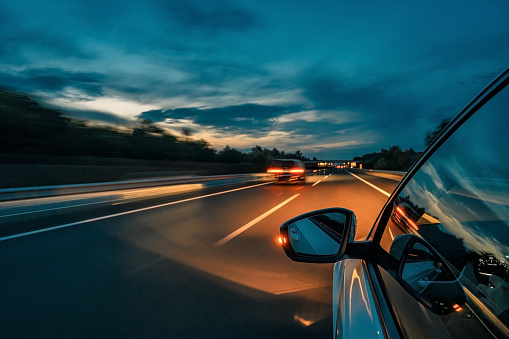 Car lights at night on the highway