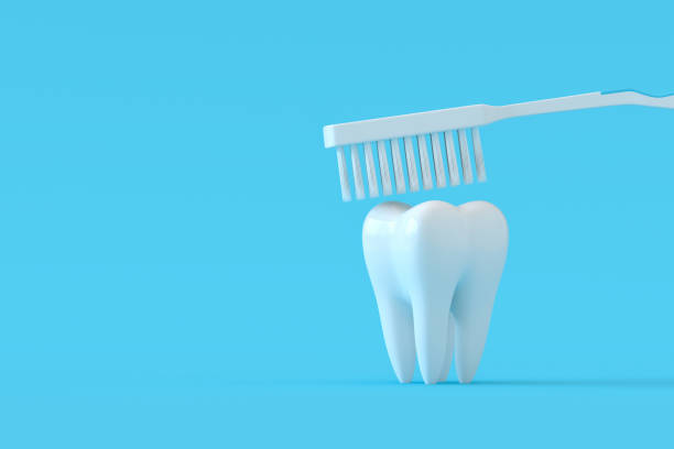 istock Toothbrush and white tooth on a blue background dental care 1363057780