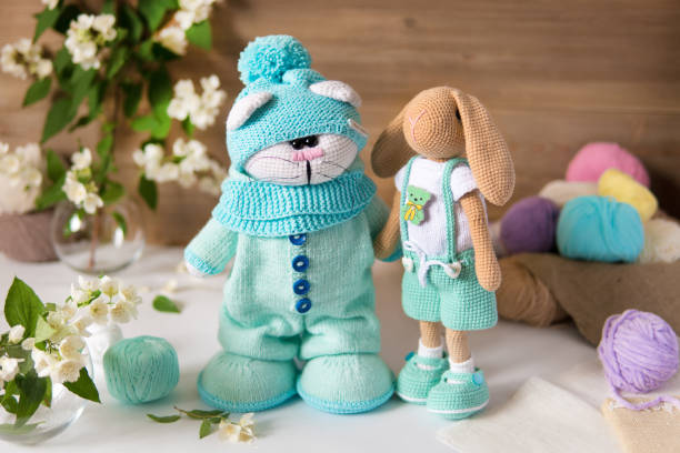 istock Toys knitted from colored threads handmade on a different background 1363058091