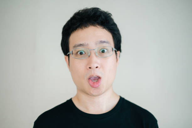 istock Funny Asian young man portrait. 1363061100