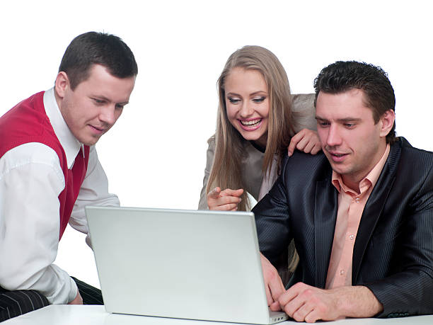 istock Two men and woman working 136306322