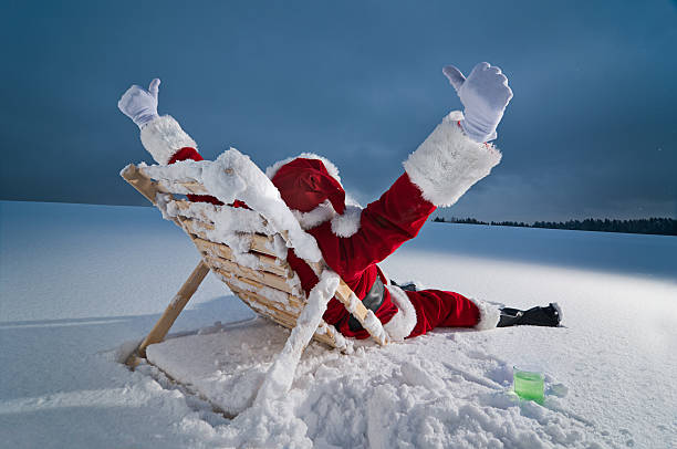 istock Santa relaxing on a sunbed 136306361