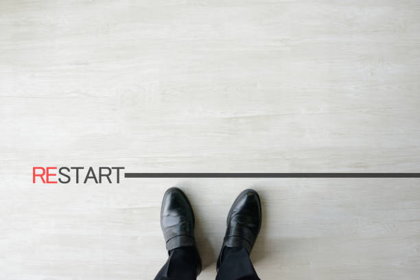 istock Business man standing by restarting line 1363065332