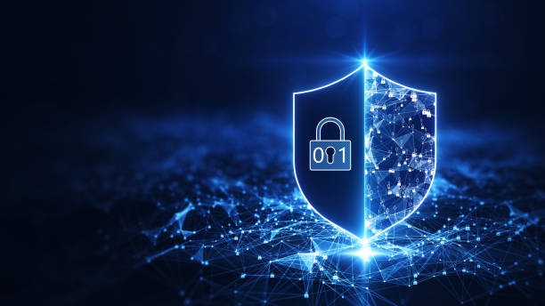 istock cyber security information protection technology background concept. The prominent shield on the right is cut in half-transparent, Showing the connection between a binary polygon and a padlock. 1363065336