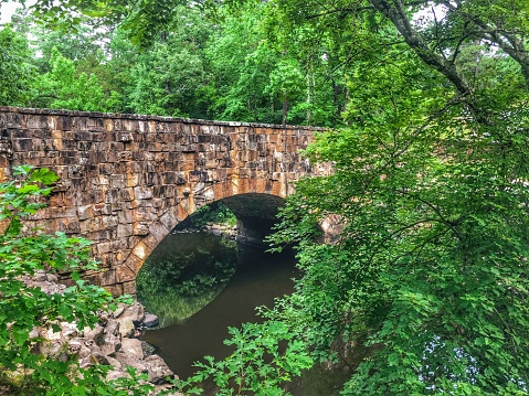 Davies Bridge, built in 1938 as part of a Civilian Conservation Corps project, spans Cedar Creek in beautiful Petit Jean State Park.