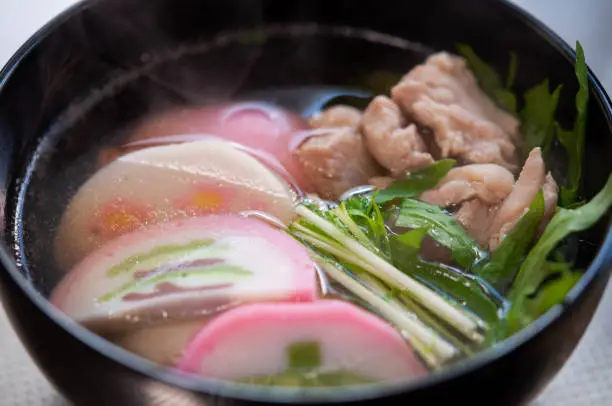 A closeup image of a bowl of Zoni rice cake soup, traditional New Year dishes in Kyushu Japan.