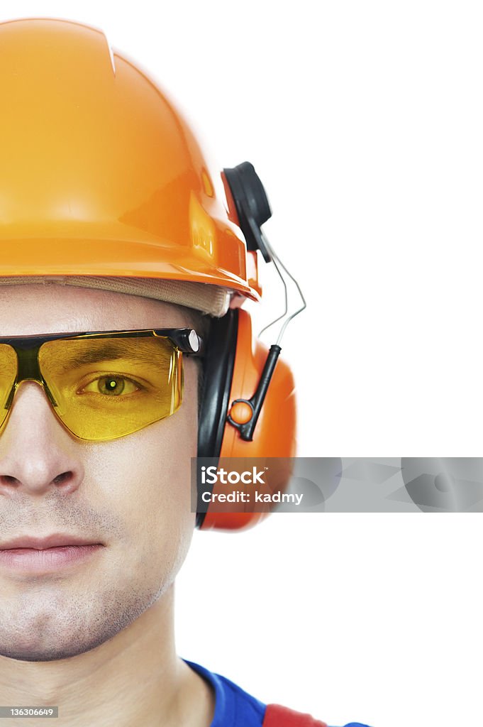 builder in Schutzhelm, Schutzbrille und Ohrenschützer - Lizenzfrei Ohrenwärmer Stock-Foto