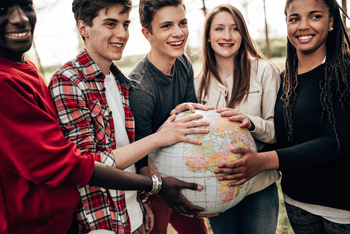 friends with globe at the park