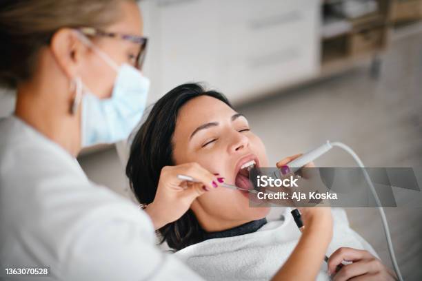 Dentist Removing Dental Calculus Stock Photo - Download Image Now - Dental Calculus, Removing, Teeth