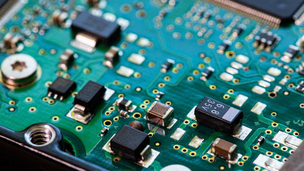 istock Macro Close up of components and microchips on PC circuit board 1363072574