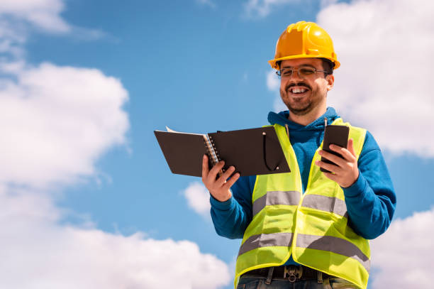 Latin male worker with hard hat and vest stock photo