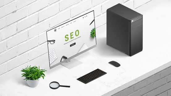 Search engine optimization concept with company website on computer display. Office desk, isometric position