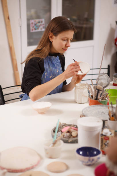 istock Professional female potter at her workshop 1363074264