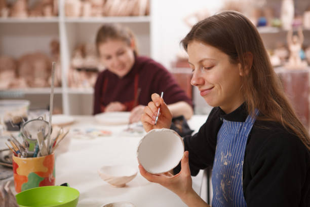 istock Female potters working at art studio 1363074327