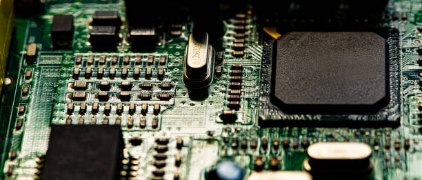 istock Macro Close up of components and microchips on PC circuit board 1363074385