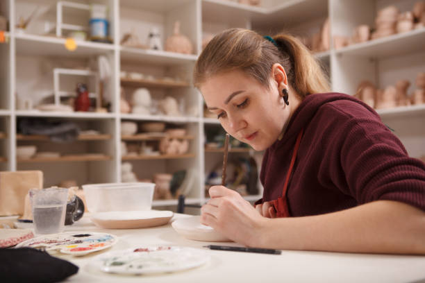 istock Professional female potter at her workshop 1363074474