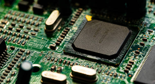 istock Macro Close up of components and microchips on PC circuit board 1363075032