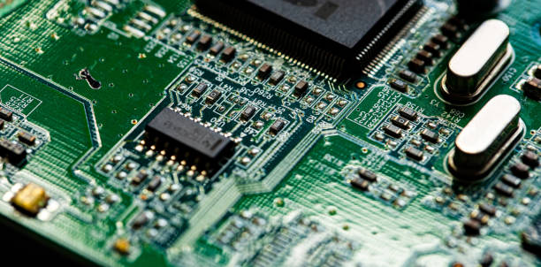 istock Macro Close up of components and microchips on PC circuit board 1363075356