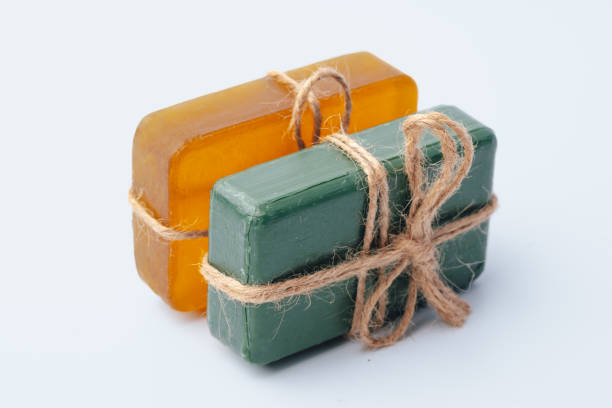 istock Natural soap bars tied with ribbon isolated on white 1363076625