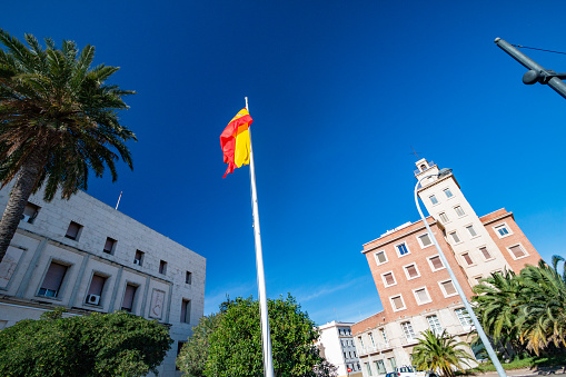 Spanish Flag at Government Building at Downtown District in Valencia, Spain. This building may have commercial elements.