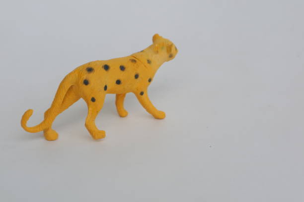istock Yellow leopard shaped toy made of plastic 1363084448