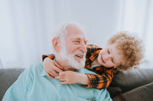 istock Grandparents and grandson playing at home 1363084608