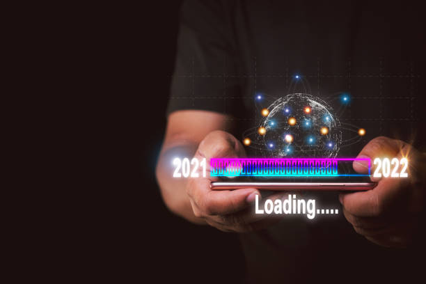 istock Businessman touching smartphone to virtual download bar Loading progress changing the new year 2021 to 2022,new ideas coming up in the future 1363084940
