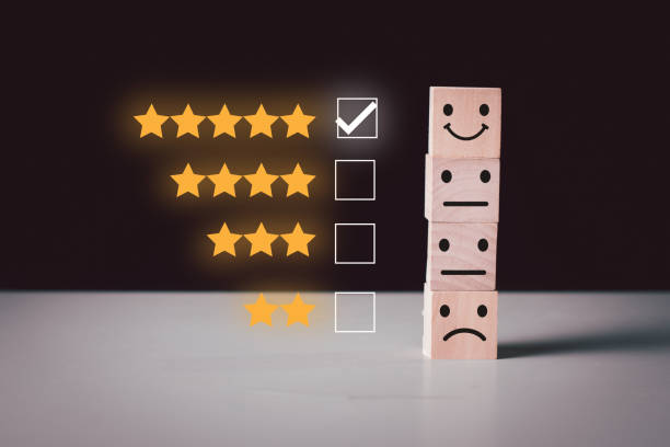 istock Best excellent smiley face five star on top wood block cube 1363085689
