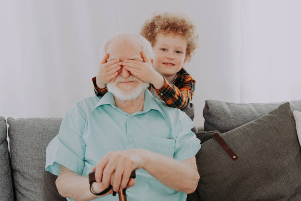 istock Grandparents and grandson playing at home 1363085807