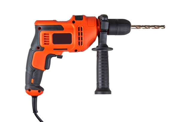 istock Orange electric drill with cable isolated on white 1363088969