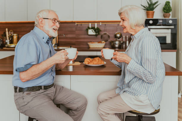 istock Elderly couple having breakfast at home 1363089817