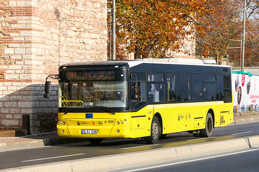 Istanbul, Turkey - October 12, 2021: Yellow city bus BMC Belde 220 SLF in a city street.