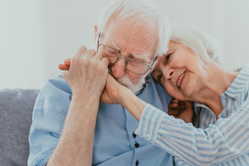 Senior couple together at home, happy moments - Elderly people taking care of each other, grandparents in love - concepts about elderly lifestyle and relationship