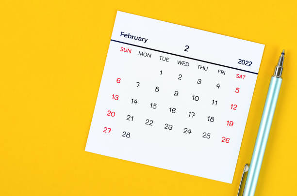 istock February 2022 calendar on yellow background. 1363092324