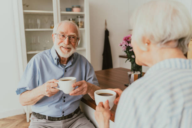 istock Elderly couple having breakfast at home 1363093009