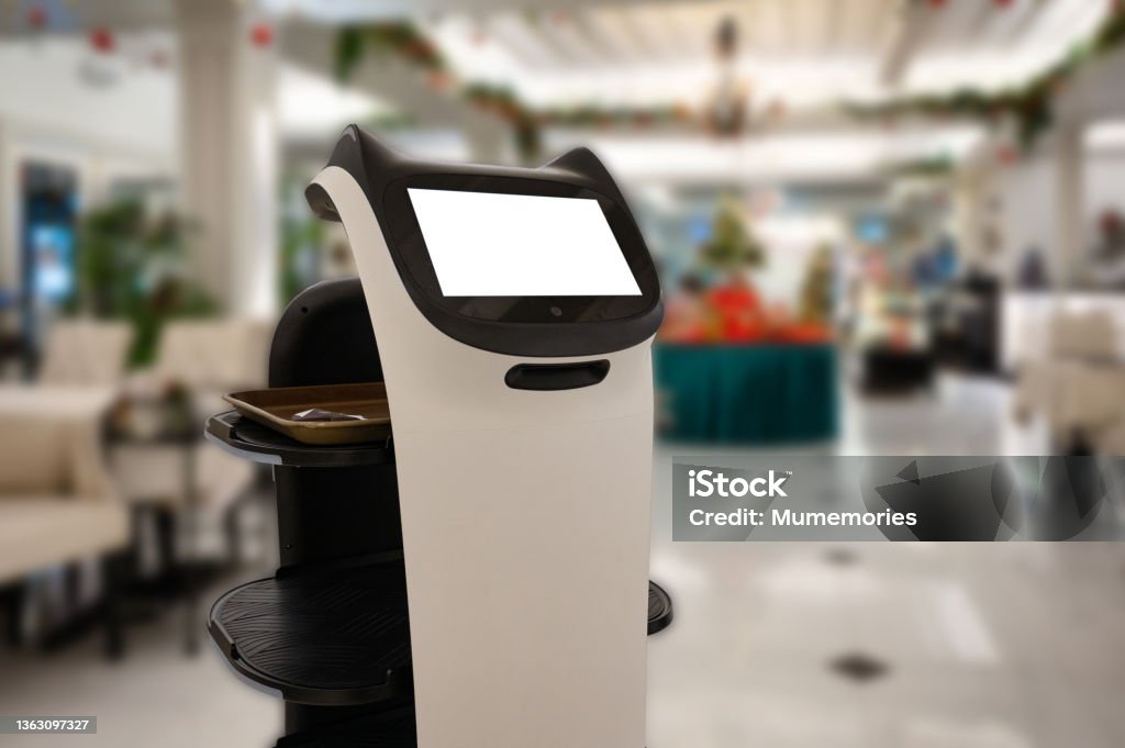 Artificial intelligence assistant personal robot for serve foods in restaurant Artificial intelligence assistant personal robot for serve foods in restaurant. Robotic trend technology business concept Robot Stock Photo